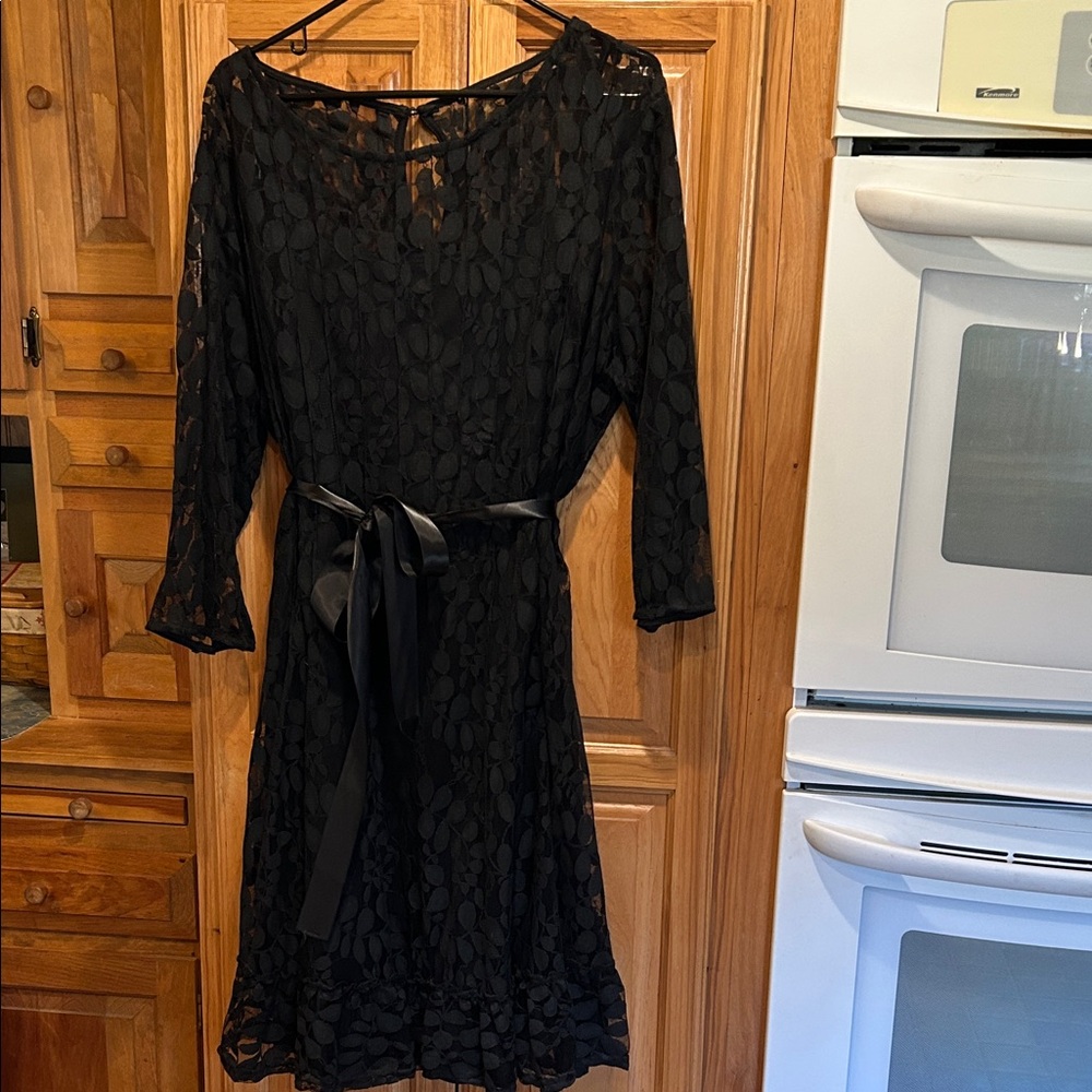 Black lace dress over solid black tank 100% polyester shell.